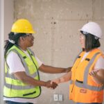 Two-construction-workers-in-safety-gear-shaking-hands-symbolizing-agreement.-2025-05-22T073032.471-0400-pexels-photo-8486896