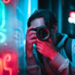 A-young-man-photographing-neon-lights-in-an-urban-setting-showcasing-vibrant-colors-and-creativity.-2025-06-12T122438.480-0400-pexels-photo-2799785