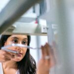 Female-engineer-focused-on-equipment-in-a-modern-lab-showcasing-technology-and-expertise.-2025-06-13T153619.750-0400-pexels-photo-3862638