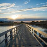 Capture-of-a-serene-sunset-over-a-wooden-bridge-in-Cavendish-PE-Canada.-2025-09-29T060437.621-0400-pexels-photo-11671899