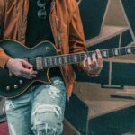 Musician-plays-electric-guitar-against-graffiti-wall-in-Toronto-urban-scene.-2025-09-29T113433.264-0400-pexels-photo-6319083